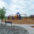 A playground with yellow, red, and blue equipment. | On-Base Housing Schriever SFB, CO