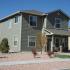A gray home with a gravel yard.  | Tierra Vista Communities Rental Houses, Schriever SFB, Colorado Springs CO