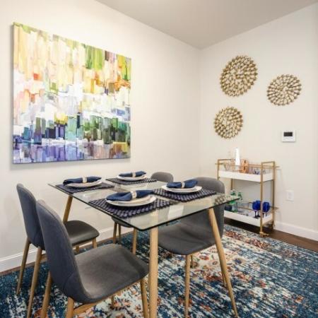Dining area with modern art on the wall | Apartments For Rent Chelmsford MA | Mill & 3 Apartments