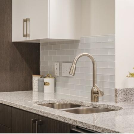 New Modern Kitchens with granite countertops and tile backsplash at Mill & 3 Apartments | Apartments For Rent In Chelmsford MA