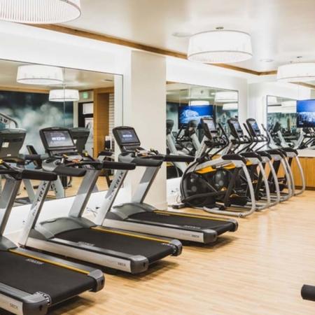 Cardio equipment includes treadmills, ellipticals and stair climbers at Modera Broadway apartments.