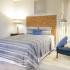 Elegant Bedroom with soft carpet | Advenir at Cocoplum