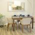Luxurious Dining Room with lots of natural light and wood flooring for easy clean up. | Advenir at Cocoplum