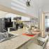 Open Concept Kitchen with Black Appliances and bar eating area kitchen | Advenir at Walden Lake