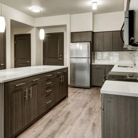 Residents Snacking in the Kitchen | Apartments For Rent Hillsboro Oregon | Tessera at Orenco Station