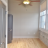 Crescendo Apartments, interior, wood flooring, large windows. gray doors, ceiling fan