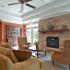 Cozy fireplace and comfortable seating in resident clubhouse at Governor Mifflin Apartments