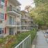 Residential buildings with balconies and red shutters at Gayley Park apartments for rent in Media, PA
