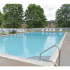 Swimming pool with lounge chairs on the sundeck at Willow Ridge Apartments in Marlton, NJ.