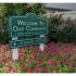 Leasing Office sign with flowers at Mill Creek Village Apartments in Langhorne, PA.