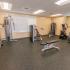 Fitness center with weight machines at Woodland Plaza Apartments in Wyomissing, PA.