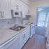 Kitchen with white appliances at Black Hawk apartments for rent in Downingtown, PA