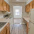 Kitchen with ample counter space and vinyl flooring at Evergreen Club apartments for rent in Broomall, PA