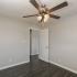 bedroom with hardwood floors at Woodgate Apartments in Springfield MO