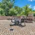 Outdoor Sundeck, Fireplace, Tables & Chairs at Deacon's Station Apartments | Near Wake Forest