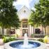 St. Moritz Entrance Surrounded by Lush Landscaping and Water Features | St. Moritz Apartments in Dallas, TX