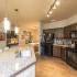 Luxurious Kitchen with Large Island, Pendant Lighting and Designer Tile Backsplash | Nashville Tennessee Apartments for Rent | 909 Flats