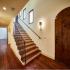 Wood stairs with vibrant etched tile risers