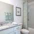 Artisan Living Bella Citta Rental Townhomes bathroom with tub shower combo