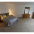 Long Pond Village Apartments, interior, carpeted, spacious bedroom, bed, nightstands, dressers, mirror, natural light
