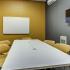 Study room with conference table, white board, and TV