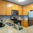 Kitchen with stainless steel appliances and wood cabinets