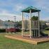 Community playground with small jungle gym at The Commons at Fallsington apartments for rent in Morrisville, PA