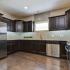 Tera Vera 55+ kitchen with hardwood floors and granite counters