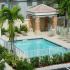 La Piazza at Young Circle, exterior, sparkling blue swimming pool, lounge chairs, palm trees