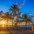 La Piazza at Young Circle, exterior, sunset at the beach, sand, palm trees,