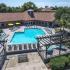 Lexington Crossing aerial view swimming pool with chairs and umbrellas