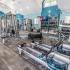 Lexington Crossing fitness center with rowing machines, pull down stations  free weights