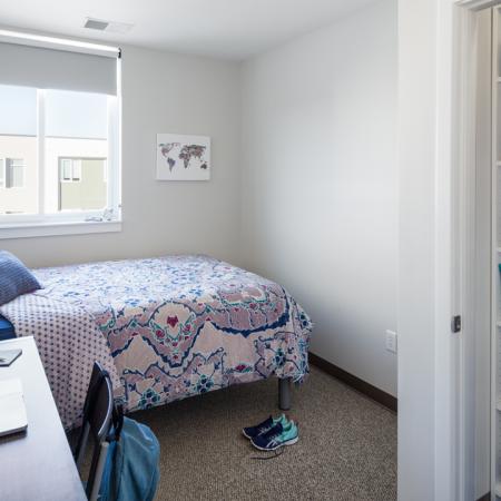 Spacious College Bedrooms, furnished with bed, desk, and chair, study, full size mattress