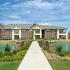 Walking path over the interior pond | The Enclave at Mira Lagos  | Apartments Grand Prairie TX