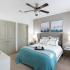 Bedroom with carpet and walk-in closets | The Enclave at Mira Lagos  | Apartments Grand Prairie TX