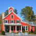 Swallowtail Flats at Old Town clubhouse and leasing office, large building, farmhouse style with well manicured landscaping