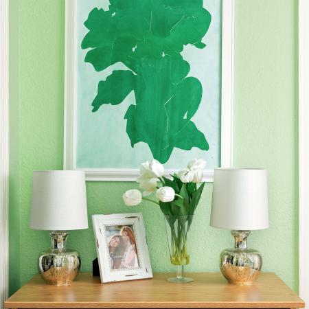 1810 The Social, interior, green wall, green art, wood dresser, lamps picture, flowers