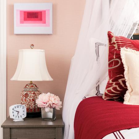 1810 The Social, interior, bedroom, white, red and pink decor, bed, wall art, desk and chair, bed curtain, laimp