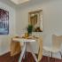 Canyon Square Apartments & Townhomes, interior, dining room, wood floor, table for two, mirror, wall art