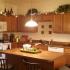 A kitchen area with light fixtures and appliances. | Rental houses near Schriever SFB, CO