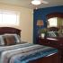 Interior decorated bedroom | blue comforter | base housing model home | Warm bedroom decorating