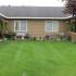 A green lawn set in between entrances to condominiums.| Fort Wainwright family housing