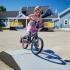 Child riding a bike at skate park
