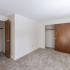 Living area featuring two closets in an apartment at Princeton at Mill Pond | Dover NH Apartments For Rent
