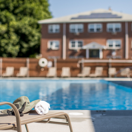 Lounge chair and pool at Princeton Crossing | Apartments for Rent in Salem, MA