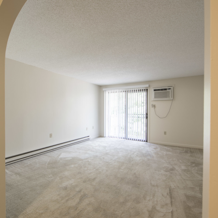 Spacious living area with sliding doors to balcony | Princeton Place | Apartments For Rent Near Worcester MA