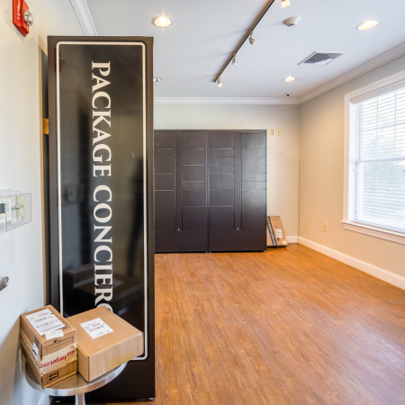 Package Receiving Room with large windows  at Princeton Westford apartments in Westford, MA.