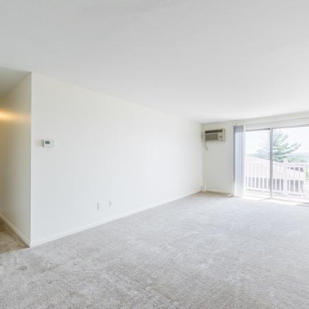 Open Floor Plan with sliding doors to balcony  in apartment at Pheasant Run  | Nashua NH Apartments