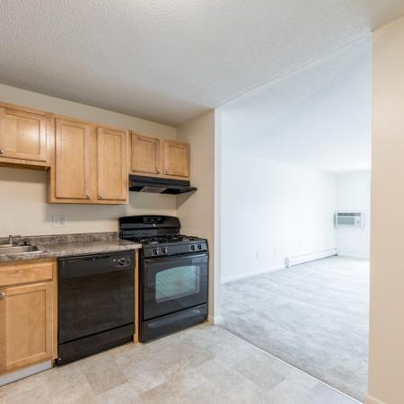 Kitchen with light color cabinetry  in apartment at Pheasant Run  | Nashua NH Apartments
