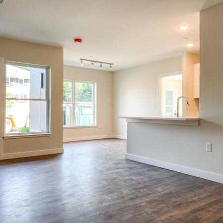 Plank-style flooring, large windows, airy space  in annex apartment at Dover Apartments in Dover, NH.